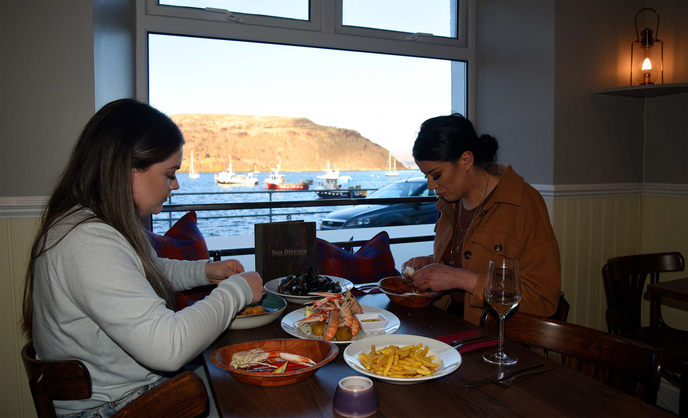 Sea Breezes Restaurant is located on Portree Pier and offers stunning Sea Views to diners